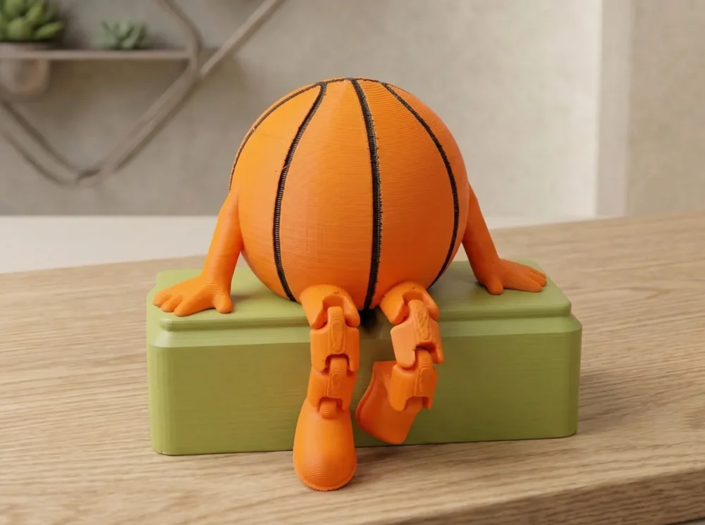 Oturan basketbol topu figürü